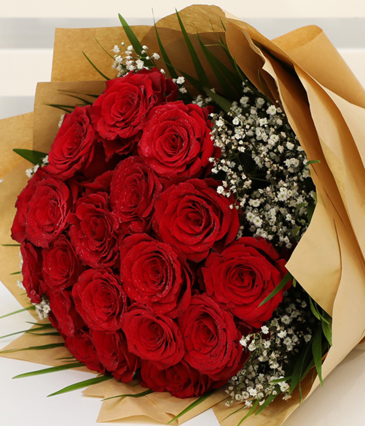 Hand Bouquet of Bewitching Red Roses